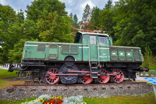 Bischofschofen, Austria - August 8, 2013: Old vintage green electric locomotive, Bischofschofen, Austria