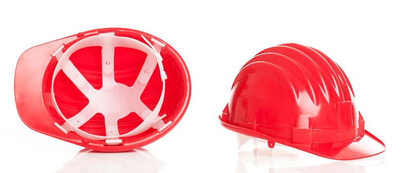 Closeup image of red builder's caps on a background