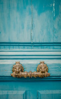 Ornate Lion Handle On A Rustic Door In Paris, France