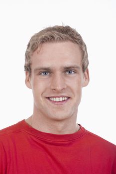 portrait of a young handsome man smiling - isolated on white