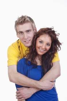 happy young couple - boy embracing girl, smiling - isolated on white