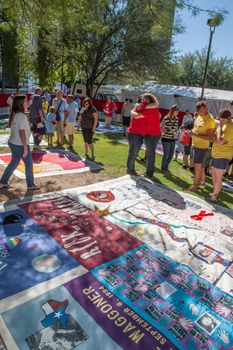 TUCSON, AZ/USA - OCTOBER 12:  Unidentifed people hugging near section of AIDS Quilt on October 12, 2014 in Tucson, Arizona, USA.