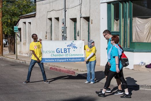 TUCSON, AZ/USA - OCTOBER 12:  Unidentified people with sign encouraging AIDSwalk participants on October 12, 2014 in Tucson, Arizona, USA.