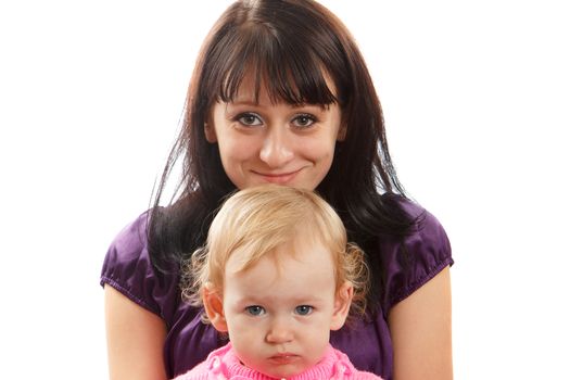 A brown haired mom with her blond little daughter