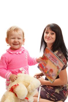 Mom and daughter playing with a toy bear and a kid book