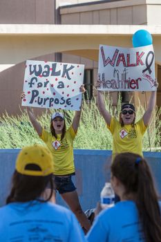 TUCSON, AZ/USA - OCTOBER 12:  Unidentified young women encouraging AIDSwalk participants on October 12, 2014 in Tucson, Arizona, USA.