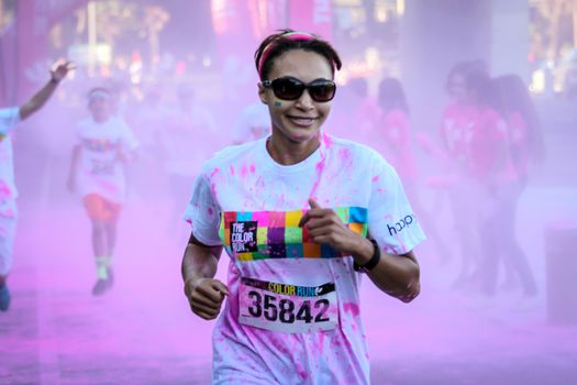 Ventura, CA - OCTOBER 18 : Participants coming through the pink color station at The Color Run 2014 in Ventura. OCTOBER 18, 2014 in Ventura, CA.