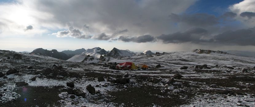 Tents under snow in the camp, Andes.