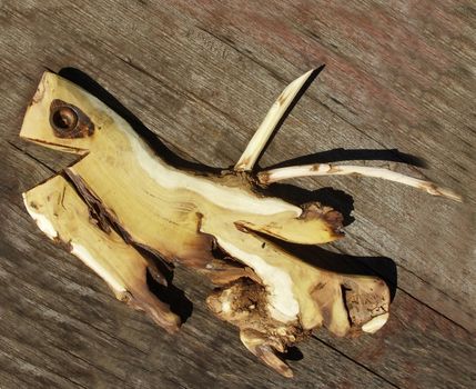 Wooden fish on wooden background