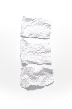 white crumpled paper over white background