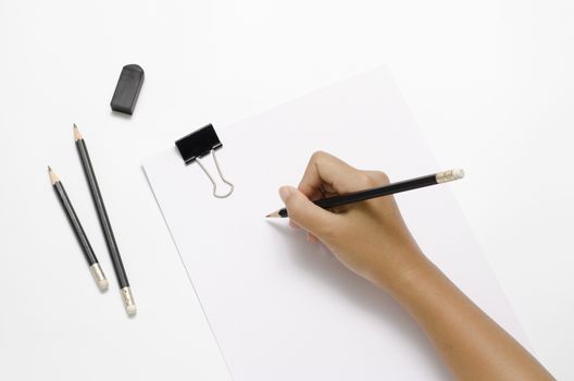 asia woman right hand writing with black pencil on paper over white background