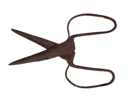 Old rusty scissors on white background