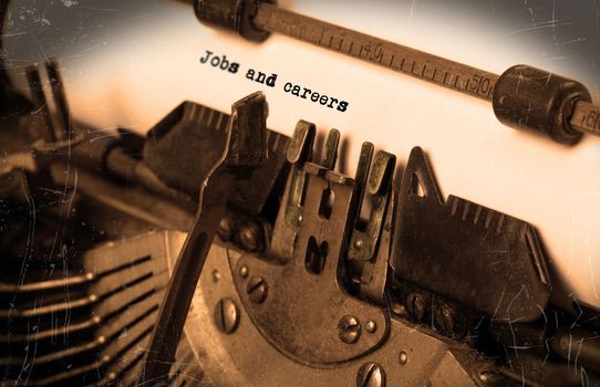 Close-up of an old typewriter with paper, selective focus, Jobs and careers