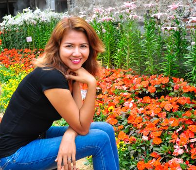 Portrait of beauty smiling pretty asian girl with beautiful flowers