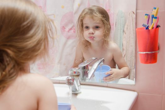 three year old girl to rinse your mouth after brushing your teeth in the bathroom