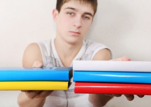 Serious Student with the Books. Focus on the Books