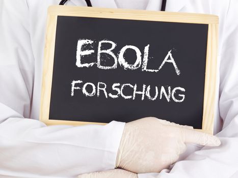 Doctor shows information: Ebola research in german