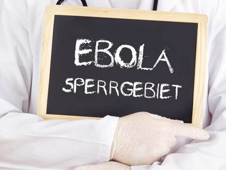 Doctor shows information: Ebola restricted area in german