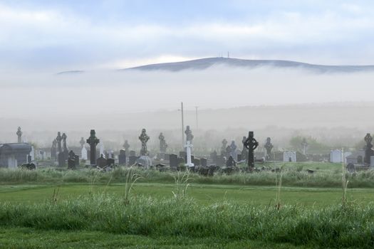 Fog rolling into the graveyard next to Ballybunion golf course in county Kerry Ireland