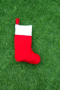 Close up of christmas socks on Green grass background