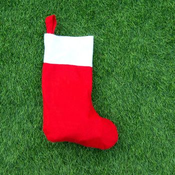 Close up of christmas socks on Green grass background