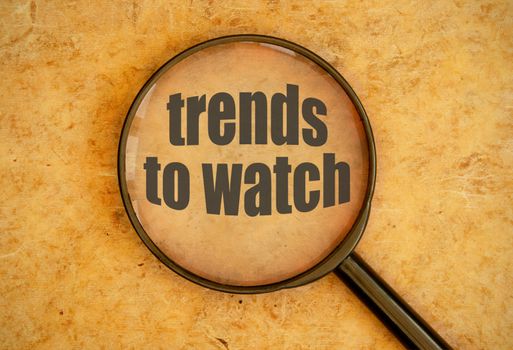 Magnifying glass over trends to watch text 