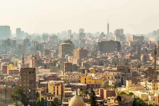 Aerial view of the city of Cairo with densely packed residential homes and buildings