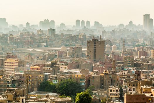 Aerial view of the city of Cairo with densely packed residential homes and buildings