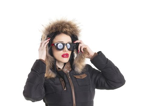 woman with sunglasses in a winter coat