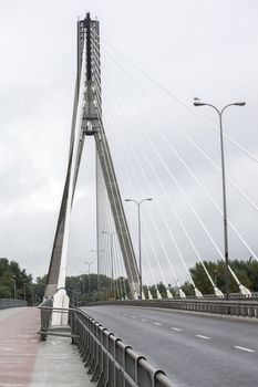 The Holy Cross or Swietokrzyski bridge over the Vistula river in Warsaw, Poland