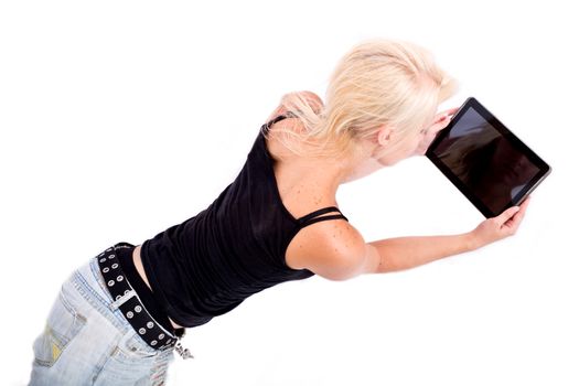 Portrait of a blonde alternative girl lying on the ground holding a tablet PC.
