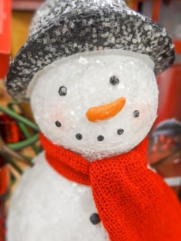 Christmas snowman in a hat and scarf