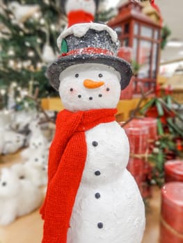Christmas snowman in a hat and scarf