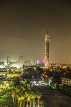 Cairo Tower brightly lit at night in Downtown Cairo, Egypt