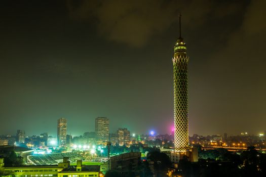 Cairo Tower colorfully lit at night in Downtown Cairo, Egypt