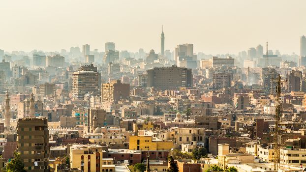 Aerial view of the city of Cairo with densely packed residential homes and buildings