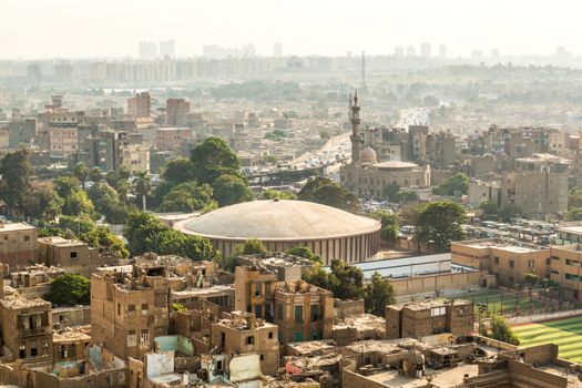 Aerial view of the city of Cairo with densely packed residential homes and buildings