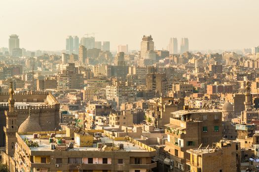 Aerial view of the city of Cairo with densely packed residential homes and buildings