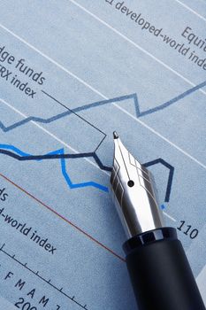 extreme closeup of a fountain pen and charts