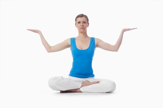 woman exercising hatha yoga - isolated on white