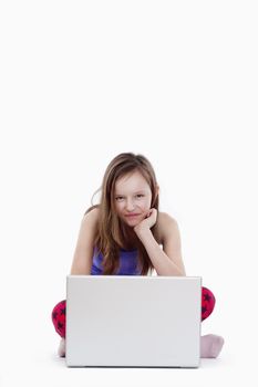 young girl with laptop computer smiling - isolated on white