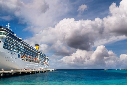 Cruise ship anchored in a caribbean port.