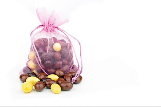 Cute pink bag full of chocolate eggs for easter