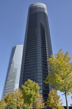 The PwC and the Crystal Towers in the Four Towers Business Area, Madrid, Spain.  
The Crystal tower was designed by Pelli and the  PWC Tower by  Carlos Rubio Carvajal y Enrique Alvarez-Sala Walther