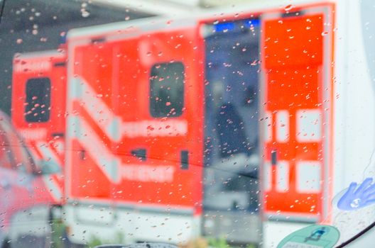 Emergency ambulance, ambulance, rescue vehicle in use in rainy weather