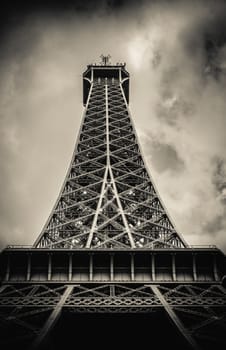 Retro Filter Eiffel Tower From Below With Moody Sky