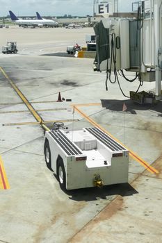 electric tug vehicle at an airport terminal