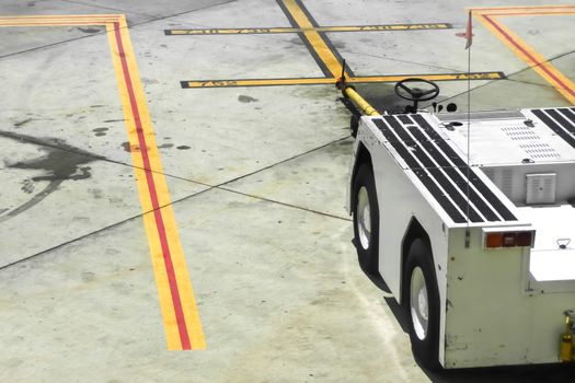 electric airport tug vehicle on a runway