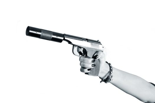 Black pistol in female hand on white a background 