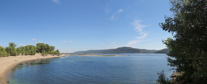 beach on the Volga River with mountain views